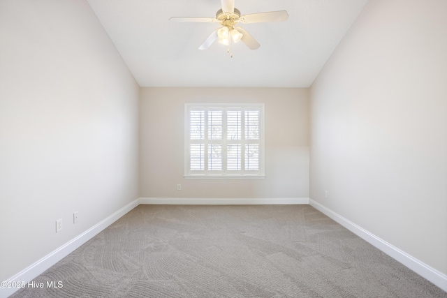 empty room featuring ceiling fan and light colored carpet