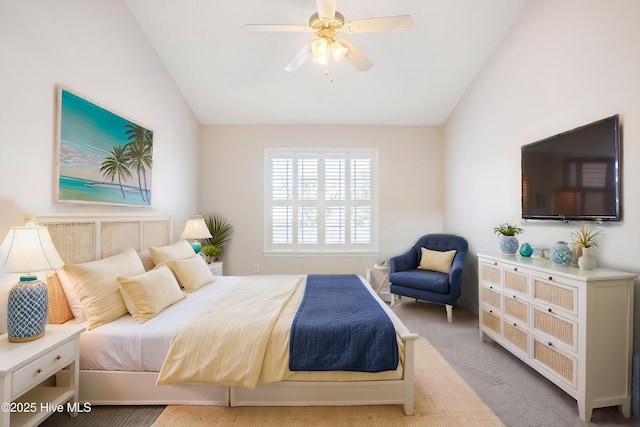 bedroom with ceiling fan, light carpet, and lofted ceiling