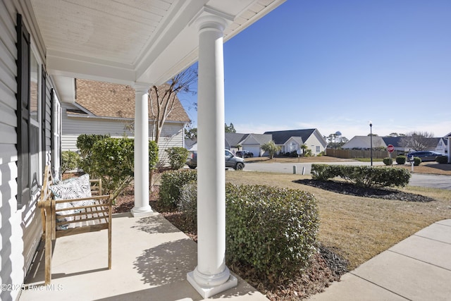 view of patio / terrace featuring a residential view and covered porch