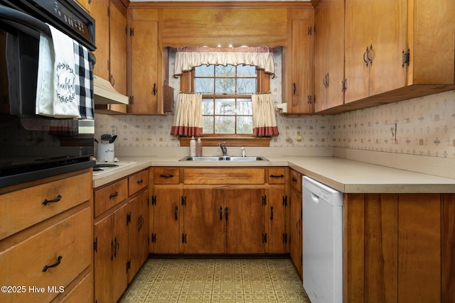 kitchen with sink and white appliances