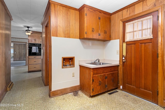 kitchen with ceiling fan, sink, and oven