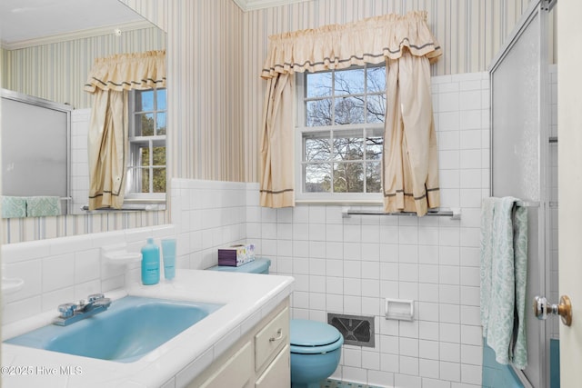 bathroom featuring tile walls, toilet, and vanity