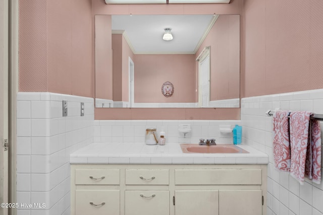 bathroom featuring ornamental molding and vanity