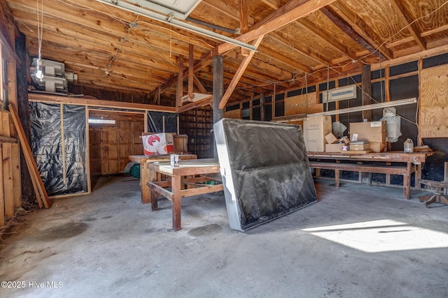 interior space featuring a workshop area and concrete floors