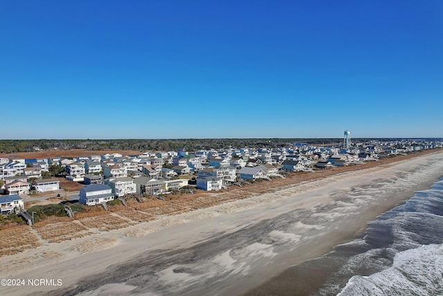 aerial view featuring a water view, a residential view, and a view of the beach