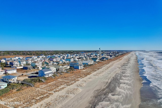 property view of water featuring a view of the beach and a residential view