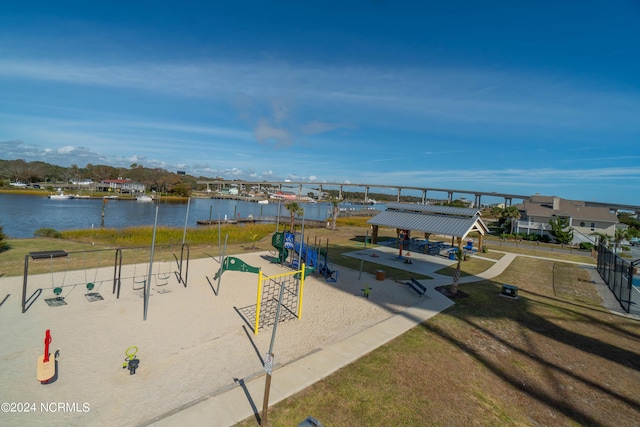 view of property's community with a lawn, a water view, playground community, a gazebo, and volleyball court