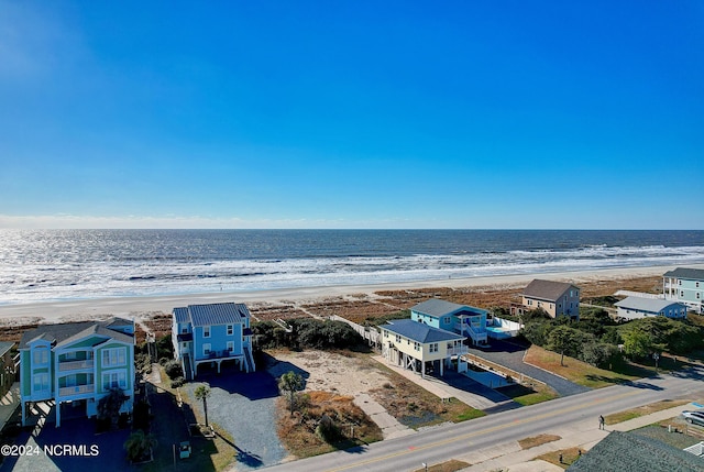 bird's eye view featuring a water view and a view of the beach