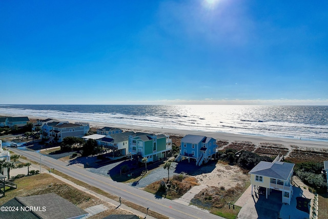 bird's eye view with a view of the beach and a water view