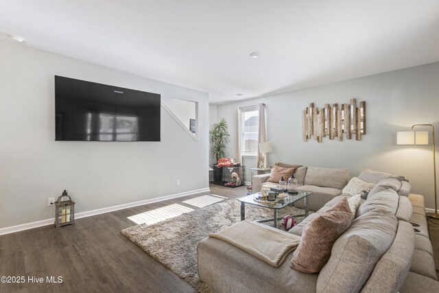 living room featuring dark wood-type flooring