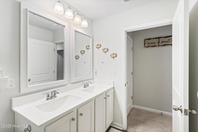 bathroom with toilet, vanity, and a shower with curtain