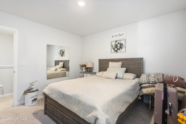 bedroom with light colored carpet