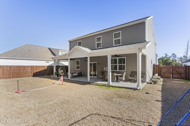 view of patio with ceiling fan, a storage shed, and an outdoor living space