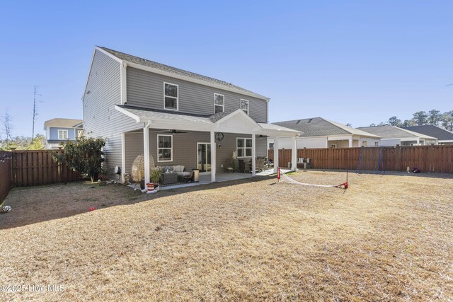 view of yard featuring ceiling fan and a shed