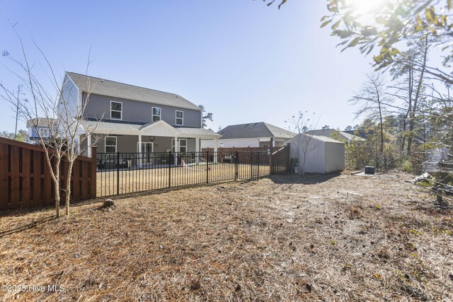 back of house with ceiling fan and a patio area