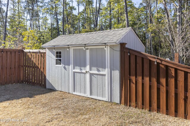 back of house with ceiling fan and a patio area