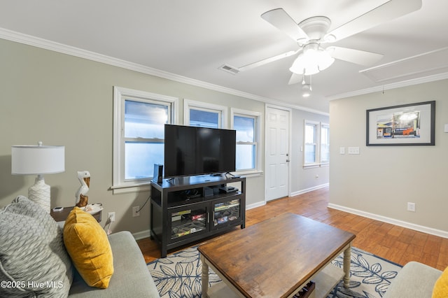 living room with ceiling fan, ornamental molding, and light hardwood / wood-style flooring