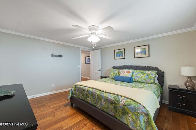 bedroom featuring ceiling fan, hardwood / wood-style floors, and ornamental molding