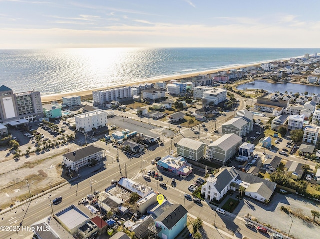 birds eye view of property featuring a view of the beach and a water view