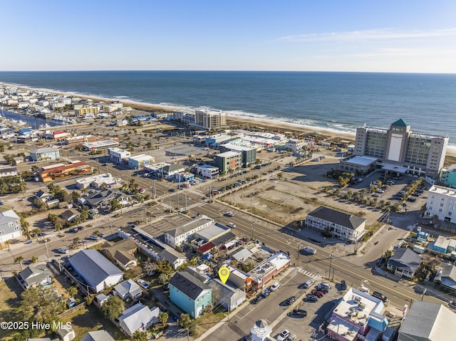 aerial view with a water view and a view of the beach