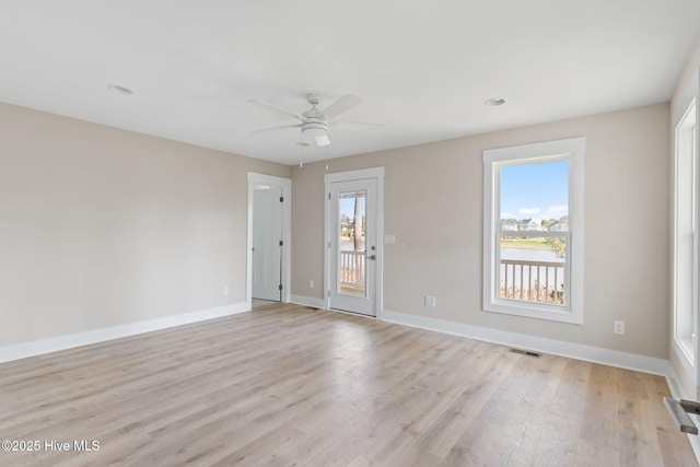 spare room with ceiling fan, visible vents, baseboards, light wood finished floors, and recessed lighting
