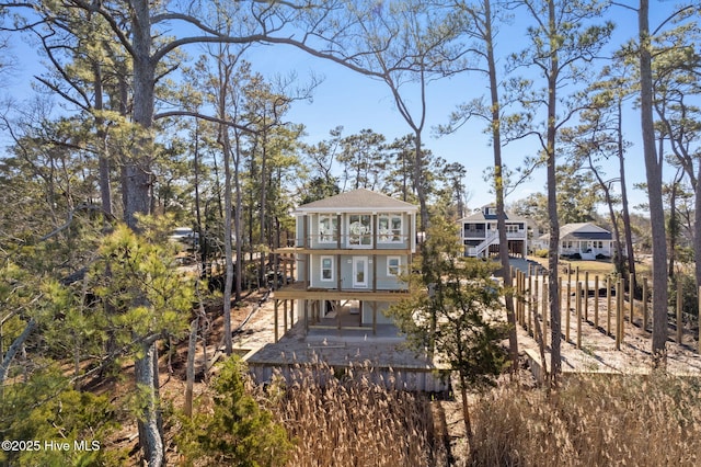 back of property with a balcony