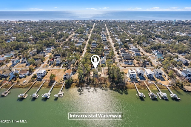 aerial view featuring a residential view and a water view