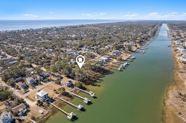 birds eye view of property featuring a water view