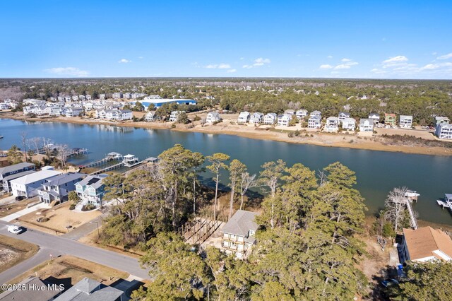 drone / aerial view with a residential view and a water view