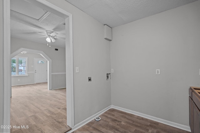 washroom with a textured ceiling, electric dryer hookup, ceiling fan, washer hookup, and hardwood / wood-style flooring