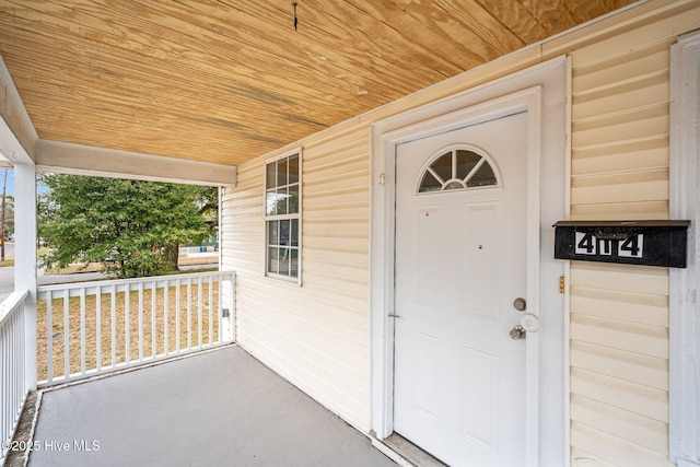 doorway to property with a porch