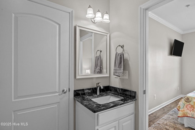 107 Beachwood Dr Unit A2, Atlantic Beach, NC 28512 - bathroom featuring ornamental molding, vanity, wood finished floors, and baseboards