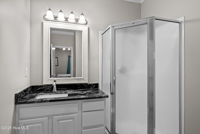 bathroom featuring crown molding, vanity, and an enclosed shower