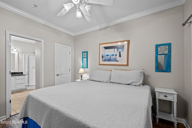 107 Beachwood Dr Unit A2, Atlantic Beach, NC 28512 - bedroom featuring crown molding, ensuite bath, and a ceiling fan