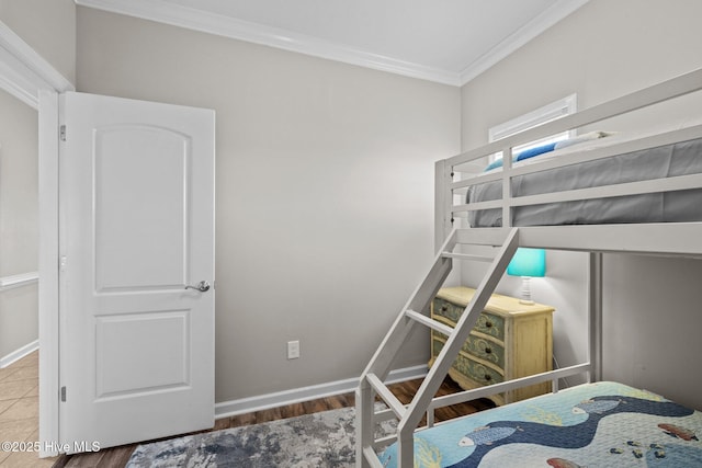 107 Beachwood Dr Unit A2, Atlantic Beach, NC 28512 - bedroom featuring crown molding, wood finished floors, and baseboards