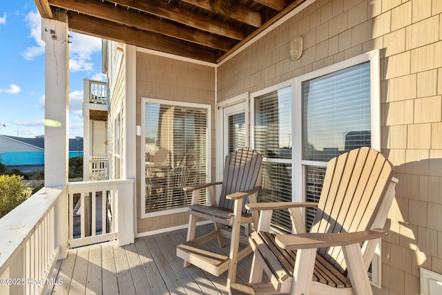 wooden deck featuring a water view