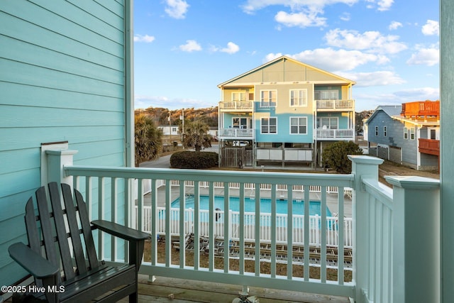 view of pool with a water view and a beach view