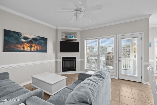 107 Beachwood Dr Unit A2, Atlantic Beach, NC 28512 - living area featuring ornamental molding, a fireplace, a ceiling fan, light tile patterned floors, and baseboards