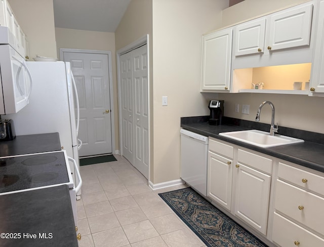 kitchen with white cabinetry, white appliances, and sink