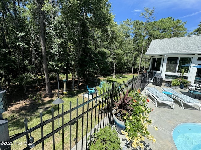 view of patio / terrace with a fenced in pool