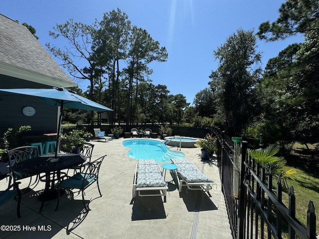 view of swimming pool featuring a patio