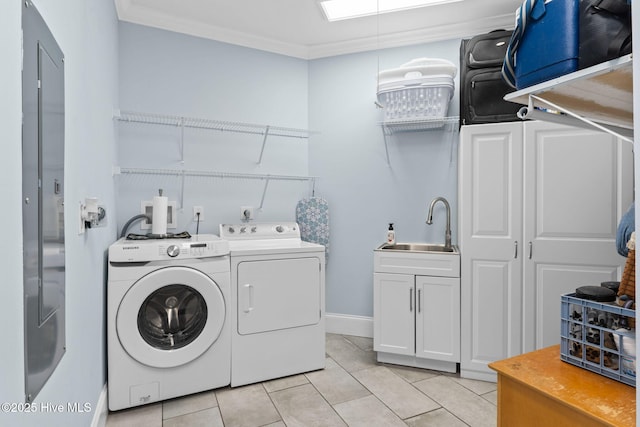 laundry area with washer and dryer, sink, cabinets, light tile patterned floors, and crown molding