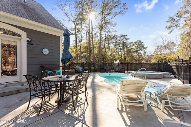 view of patio / terrace featuring a fenced in pool and pool water feature