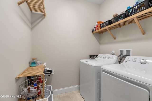 washroom with washer and dryer