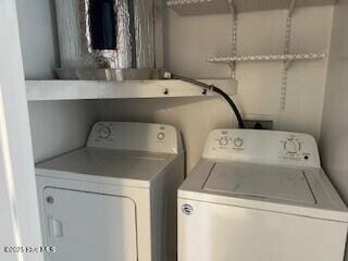 laundry room featuring washing machine and dryer