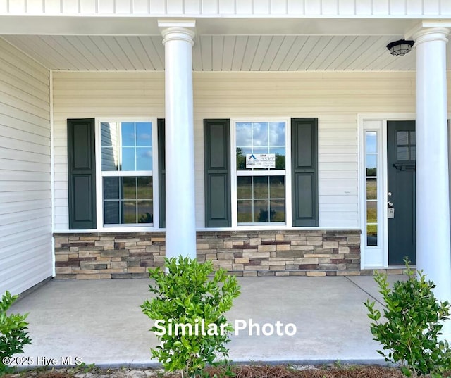 property entrance with covered porch