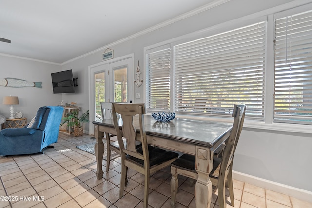 dining room with ornamental molding and light tile patterned floors