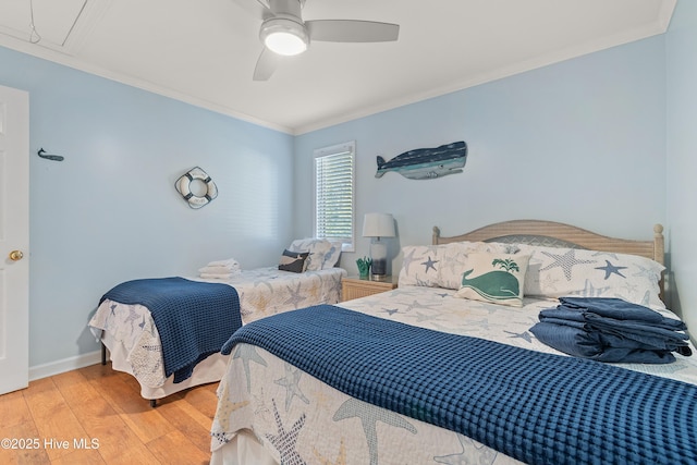 bedroom featuring wood-type flooring, crown molding, and ceiling fan