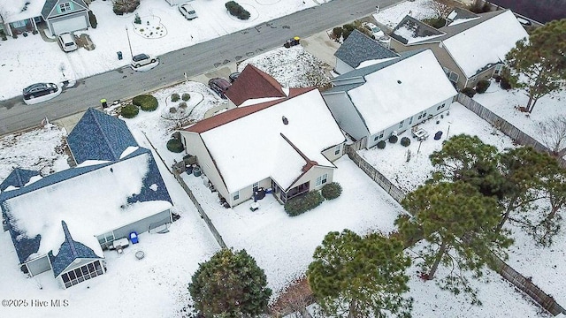 snowy aerial view featuring a residential view