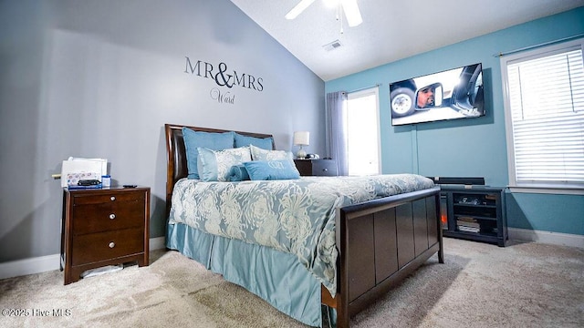 bedroom with carpet floors, lofted ceiling, visible vents, ceiling fan, and baseboards